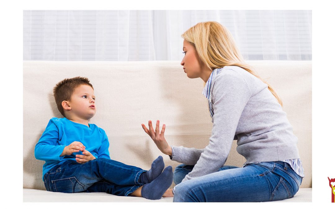 mother and son talking together on couch