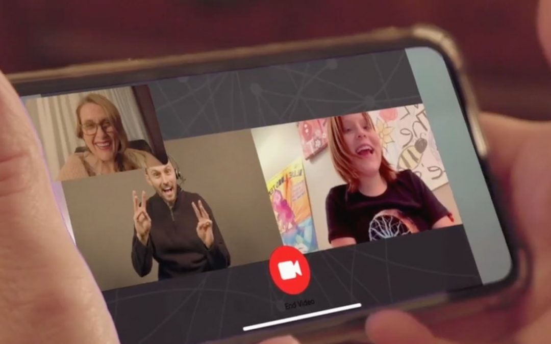 shows image of a phone showing a deaf person, a hearing person, and an interpreter on a video relay call using wavello app from svrs