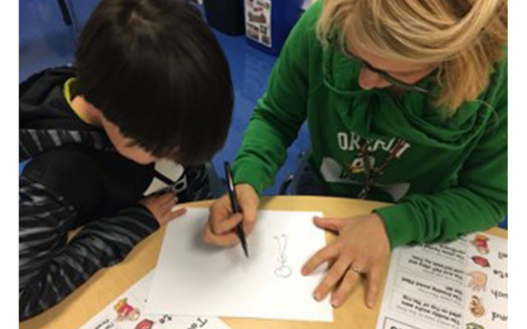 making language visual webinar - image shows a woman drawing a simple picture for a child